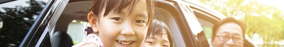 child and family in car