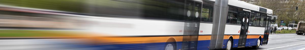 transit bus driving on street
