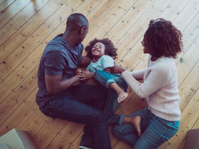 family on wood floor