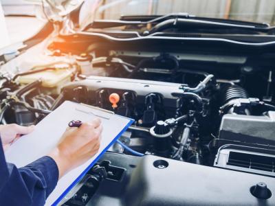 mechanic checking engine