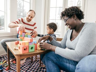 Parents playing with young child